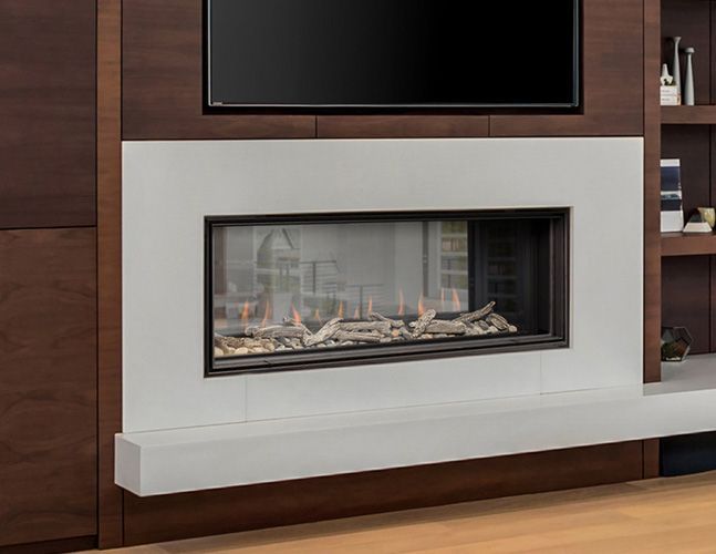 A fireplace with a television mounted above it in a living room.