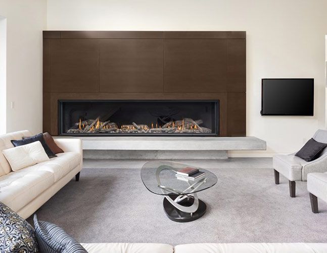 A living room with a fireplace and a flat screen tv