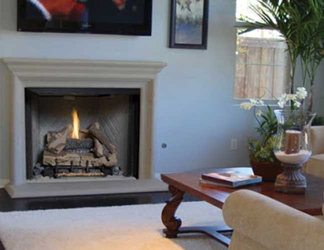 A living room with a fireplace and a coffee table
