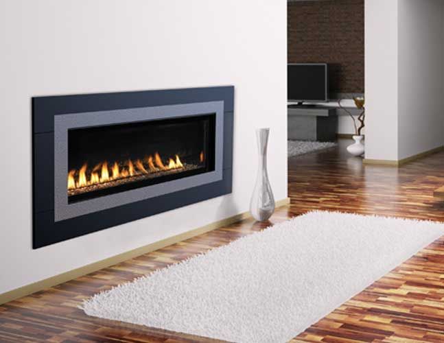 A living room with a fireplace and a rug