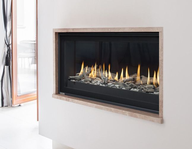 A fireplace is built into a wall in a living room.