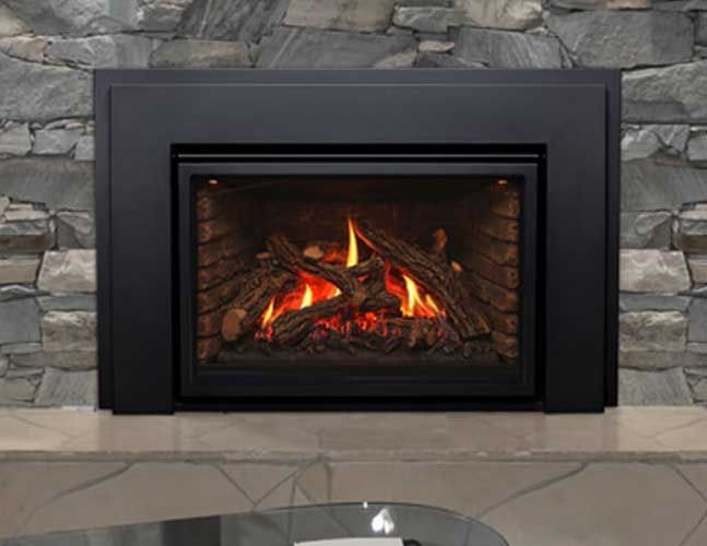 A fireplace with a glass table in front of it and a stone wall behind it.