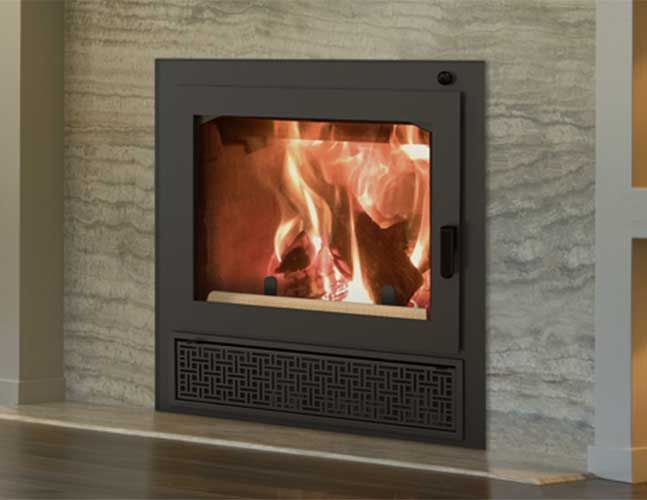 A fireplace is built into a brick wall in a living room.