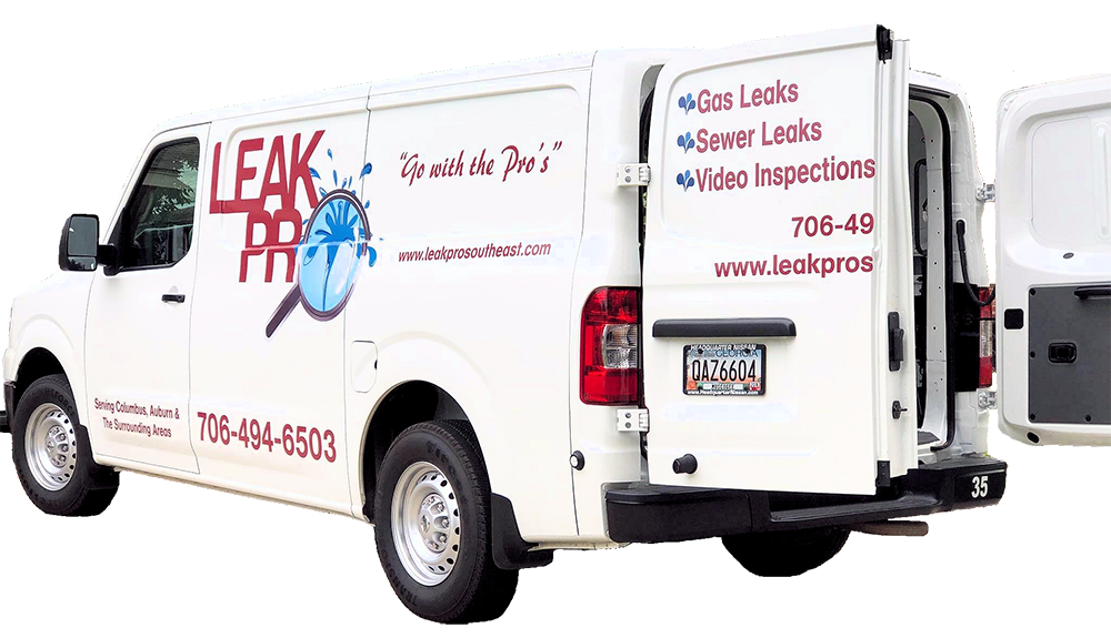 A white van with leak pro written on the side is parked on a white background.
