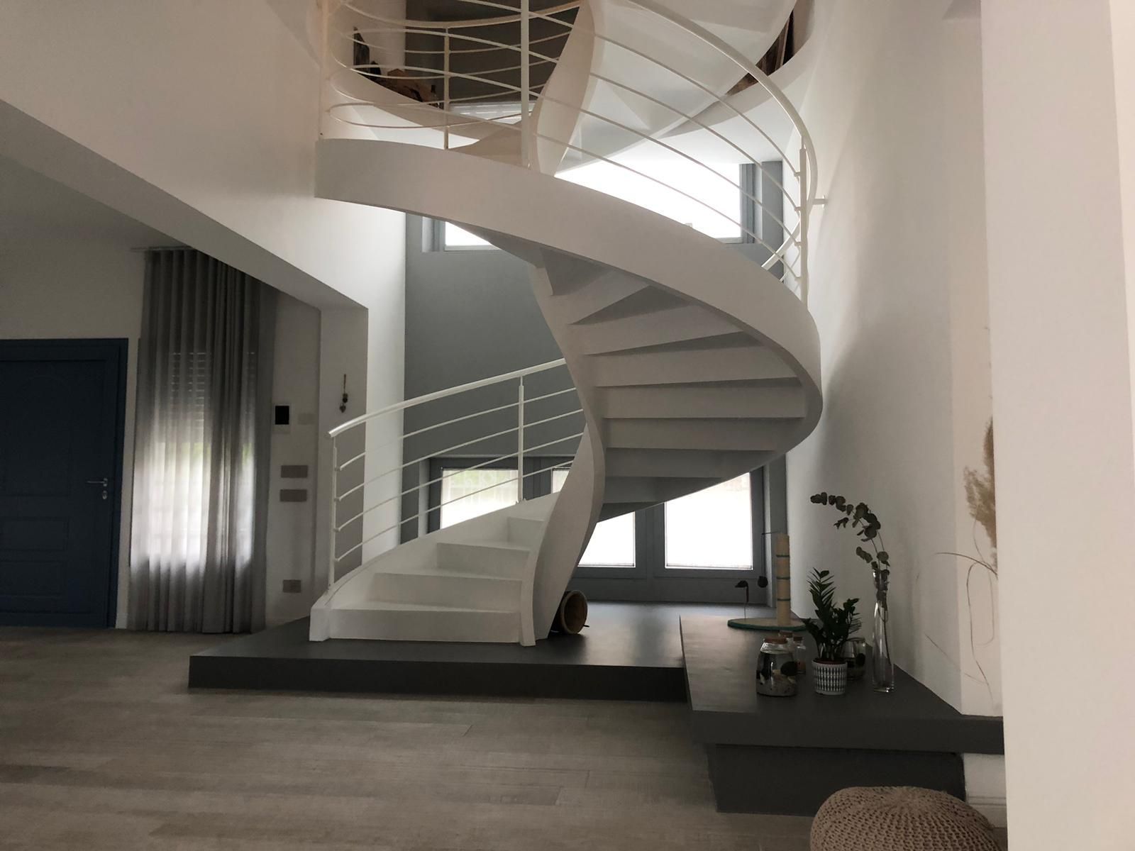 Metal railing concrete helical stairs in San Mauro di Saline