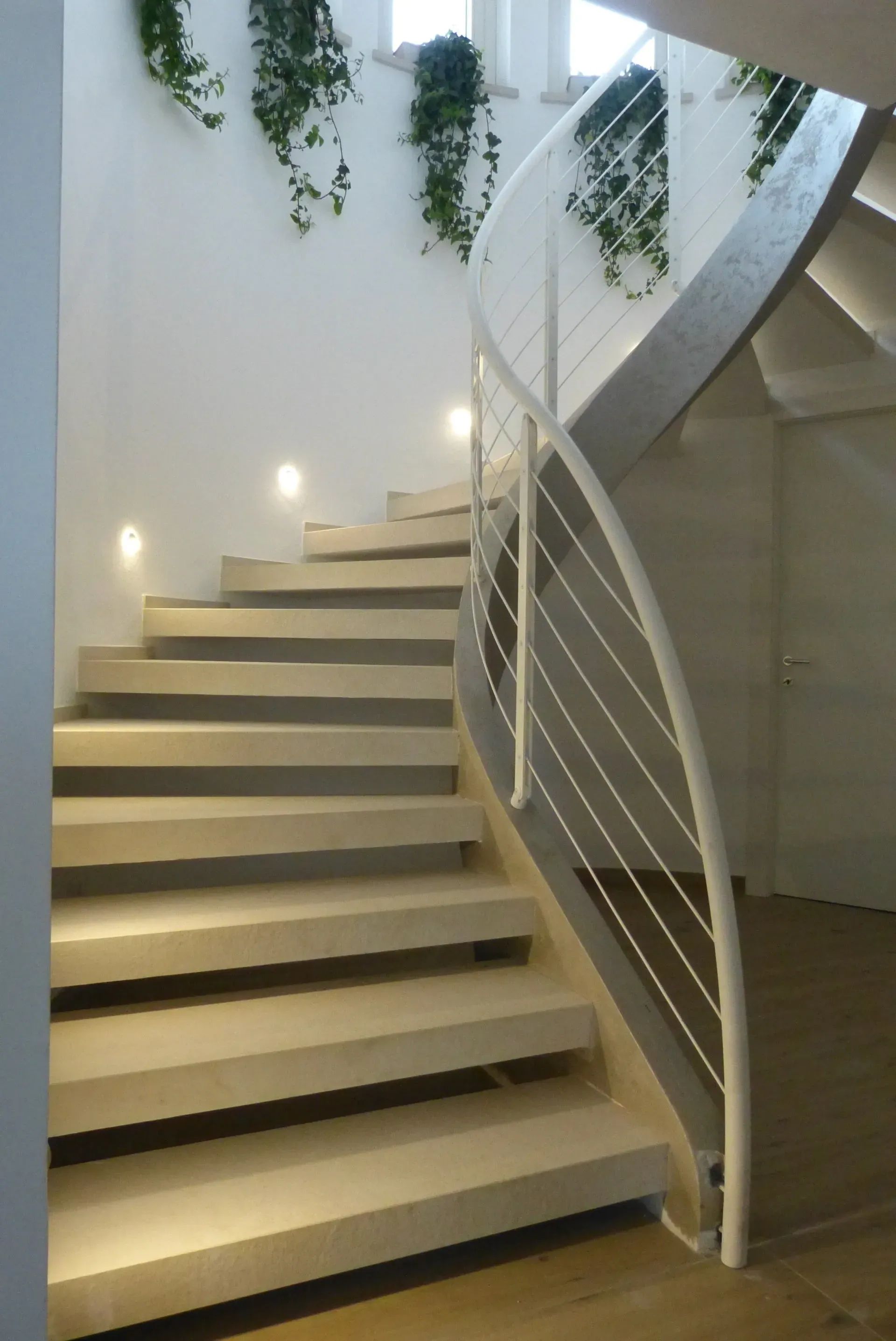 Metal railing Concrete spiral stairs in San Mauro di Saline