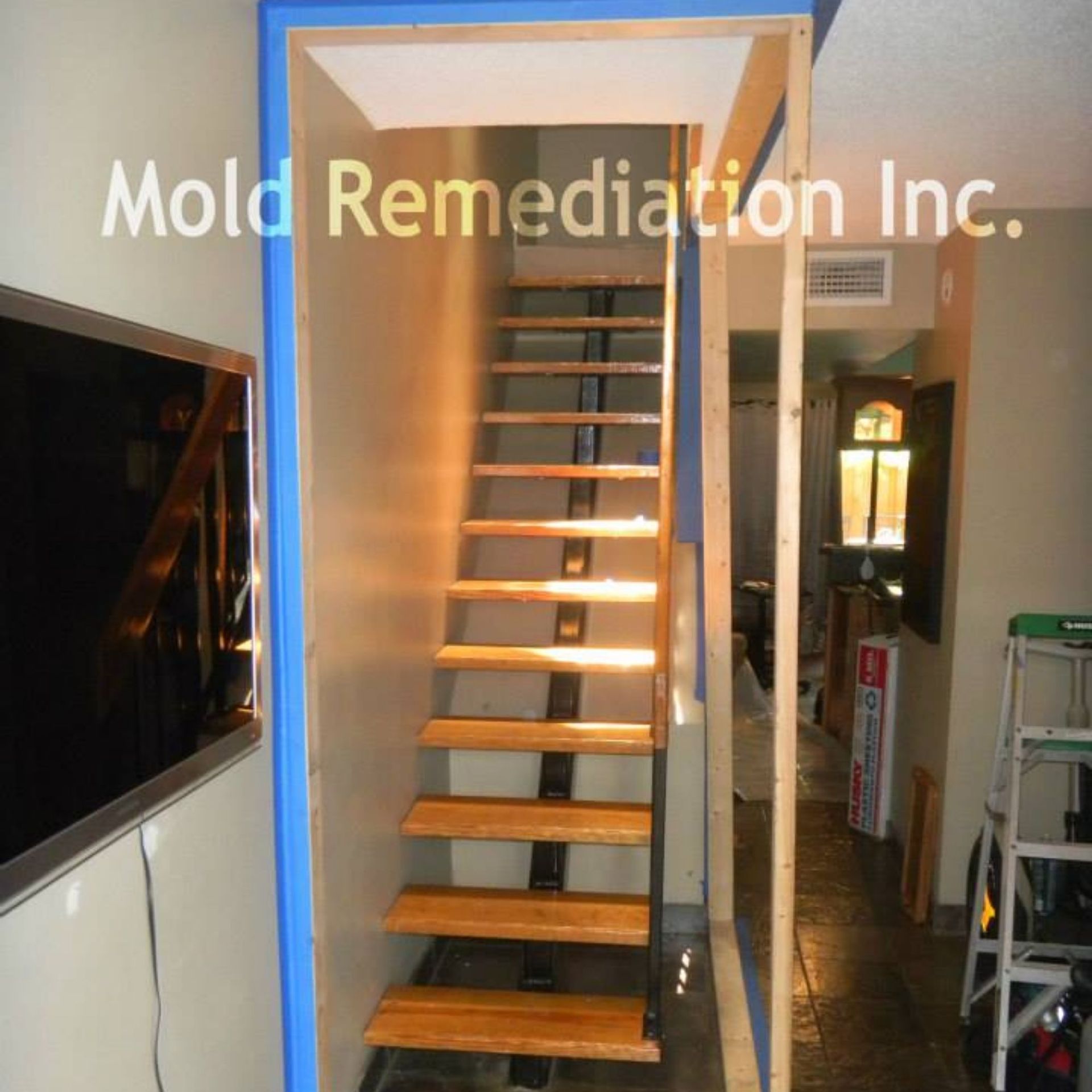 Mold Remediation Inc -A picture of a staircase with the words mold remediation inc. above it