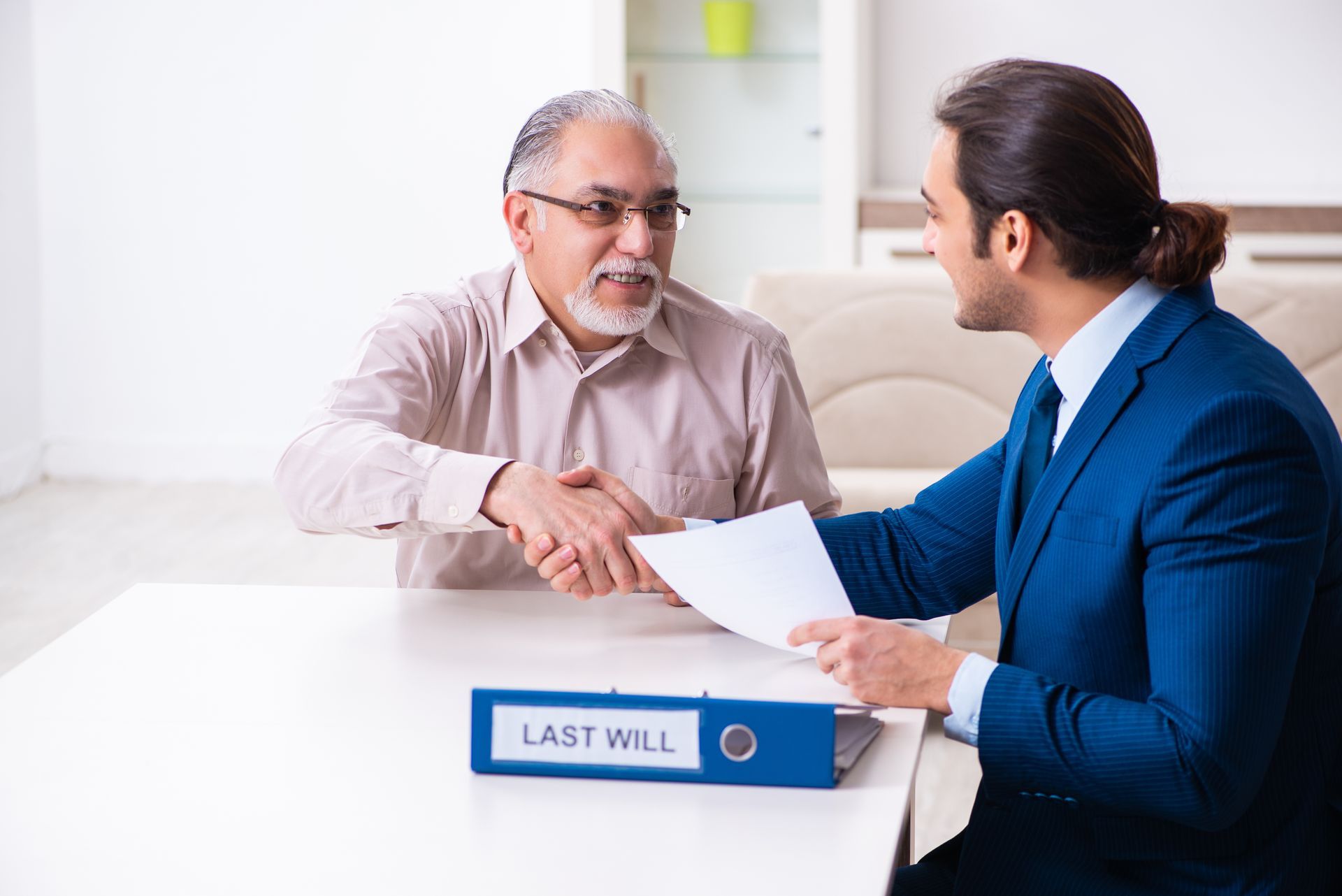 A probate attorney is reviewing the last will with the client during the consultation. A probate attorney is reviewing the last will with the client during the consultation.