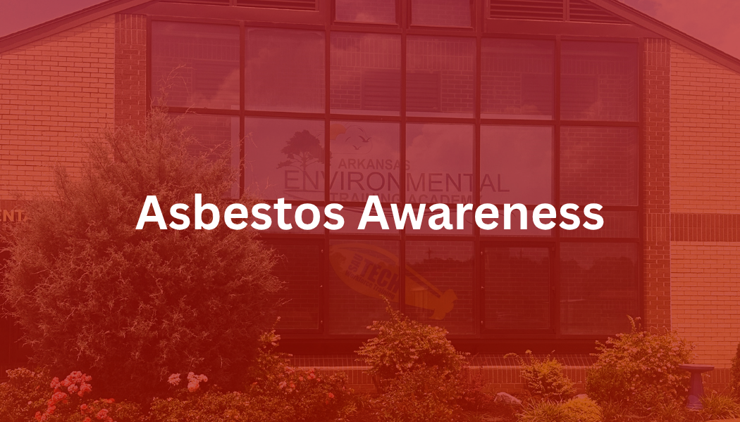 Red-tinted building facade with the word “Asbestos” centered over it