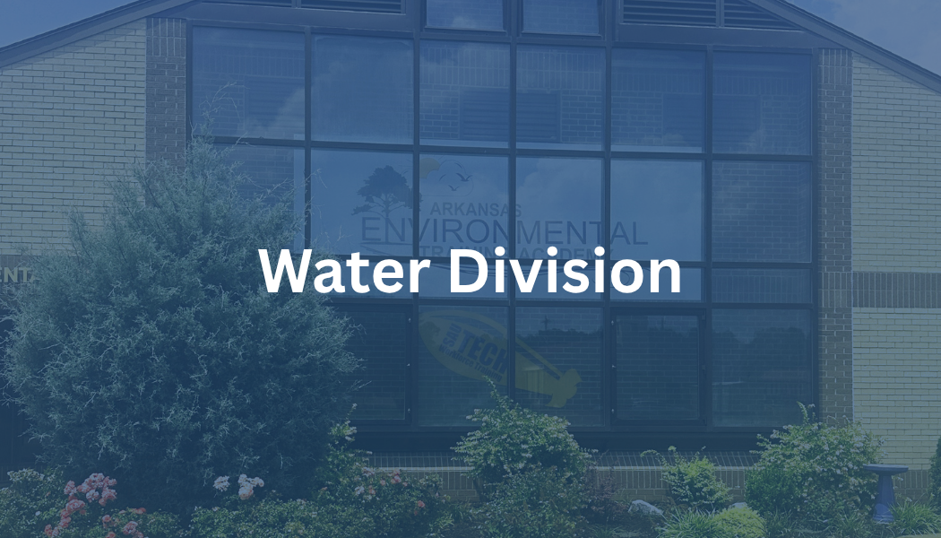 Blue-tinted building facade with the words “Water Division” over the entrance.