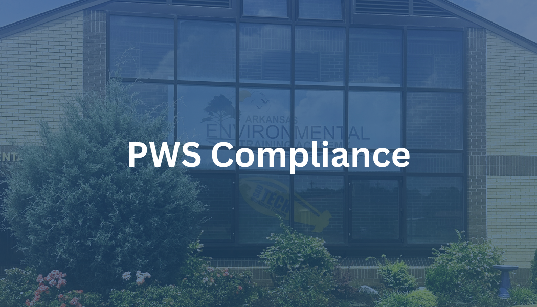 PWS Compliance text over a blue-tinted building exterior with trees in front