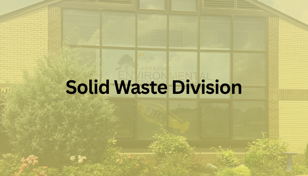 Yellow-tinted building entrance with the text “Solid Waste Division” overlaid.