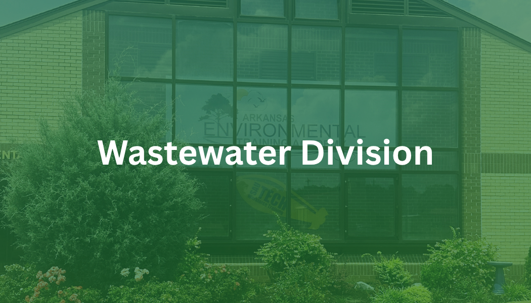 Green-tinted building exterior with the text “Wastewater Division” centered on it
