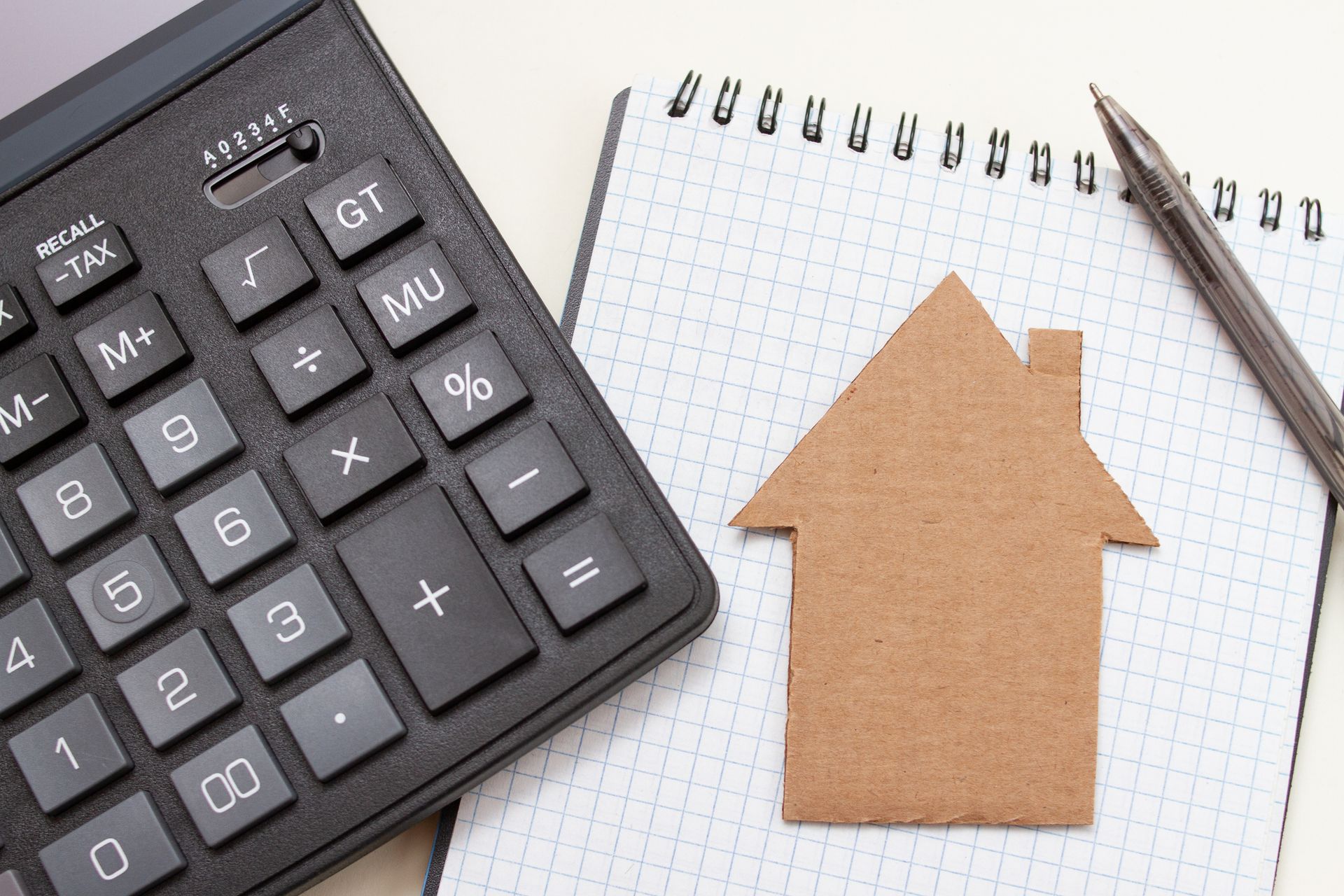Cardboard House Icon on a Notepad and Calculator – Odessa, FL – Englebert-Morgan, Inc. Cardboard House Icon on a Notepad and Calculator – Odessa, FL – Englebert-Morgan, Inc.