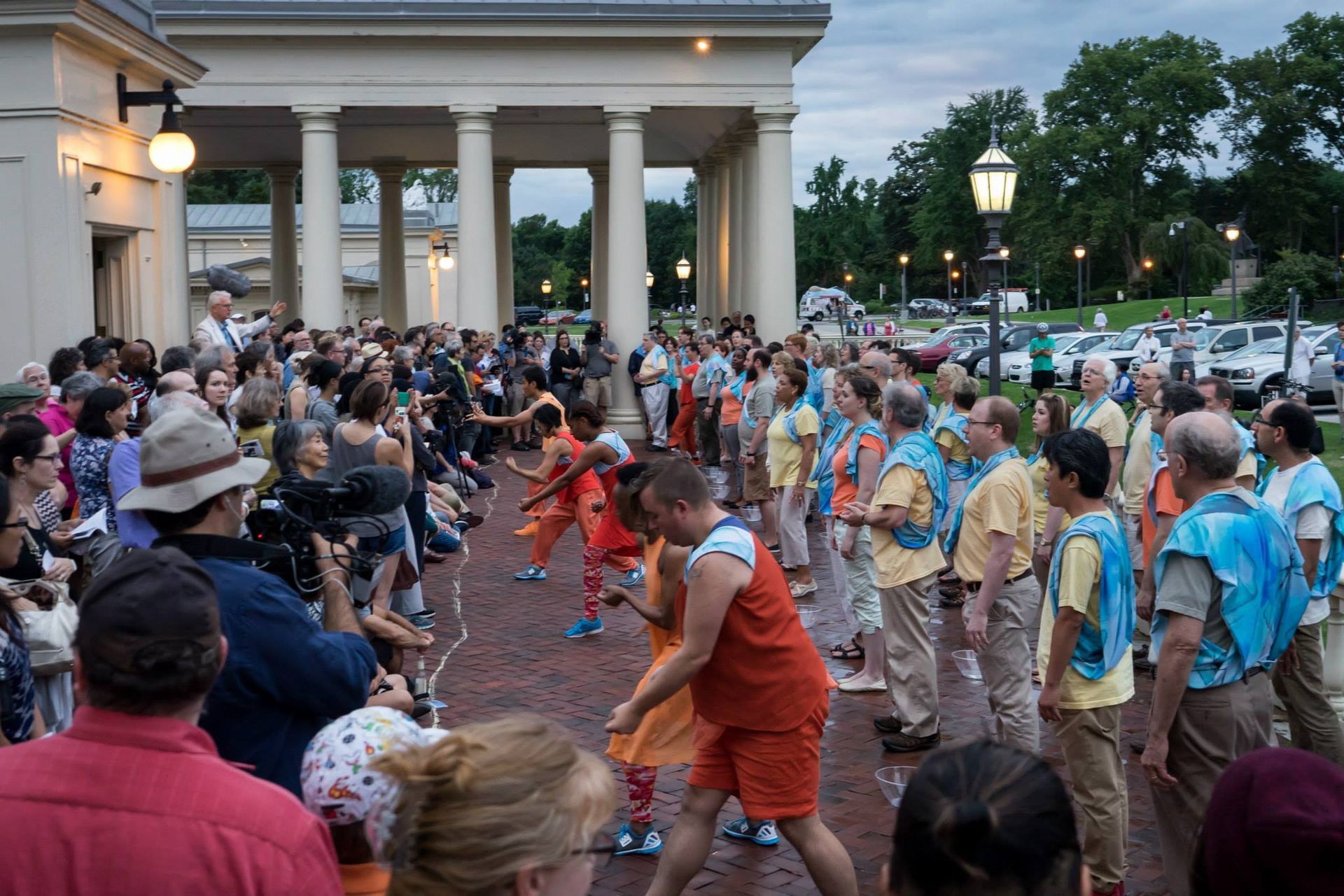 A large group of people are standing in front of a building.
