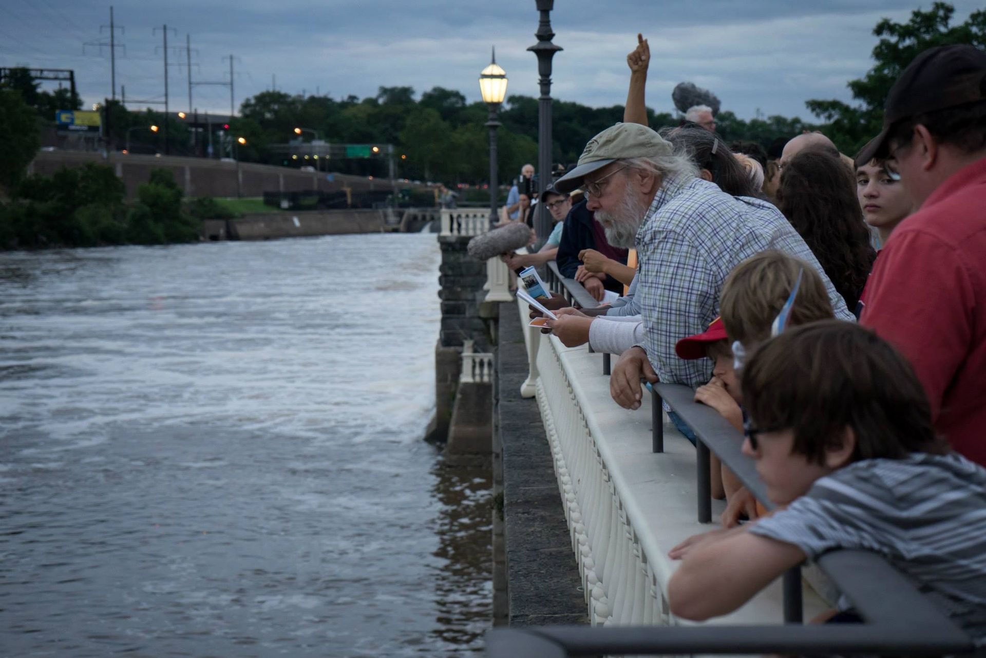 A group of people looking out over a body of water