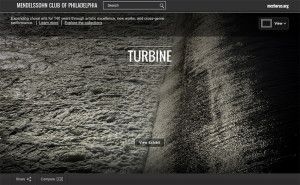 A black and white photo of a turbine on a website.