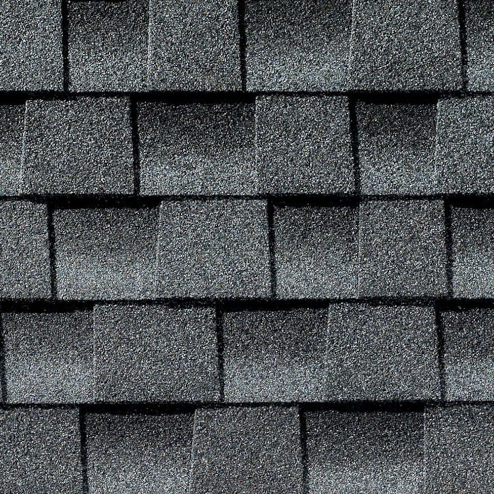 A pattern of dark gray, rectangular asphalt roof shingles overlapping in horizontal rows.