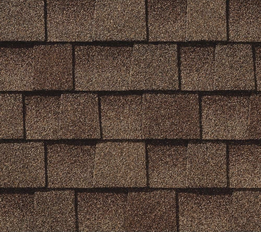 A pattern of brown architectural asphalt roof shingles with a textured, layered appearance.