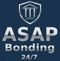 Logo for ASAP Bonding 24/7 featuring a white shield icon with three columns, text in silver, set on a dark blue background.