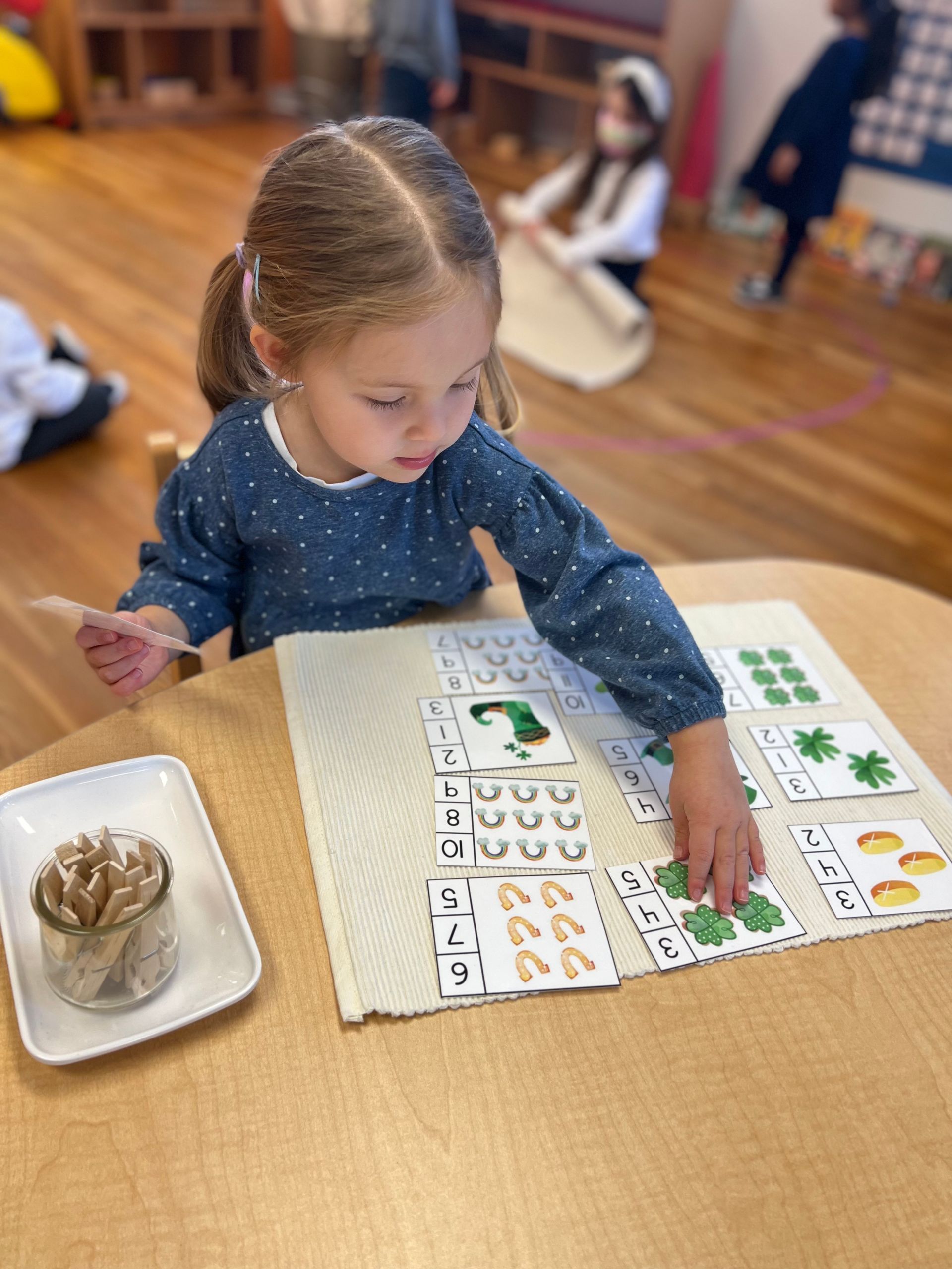 Montessori child working with math materials