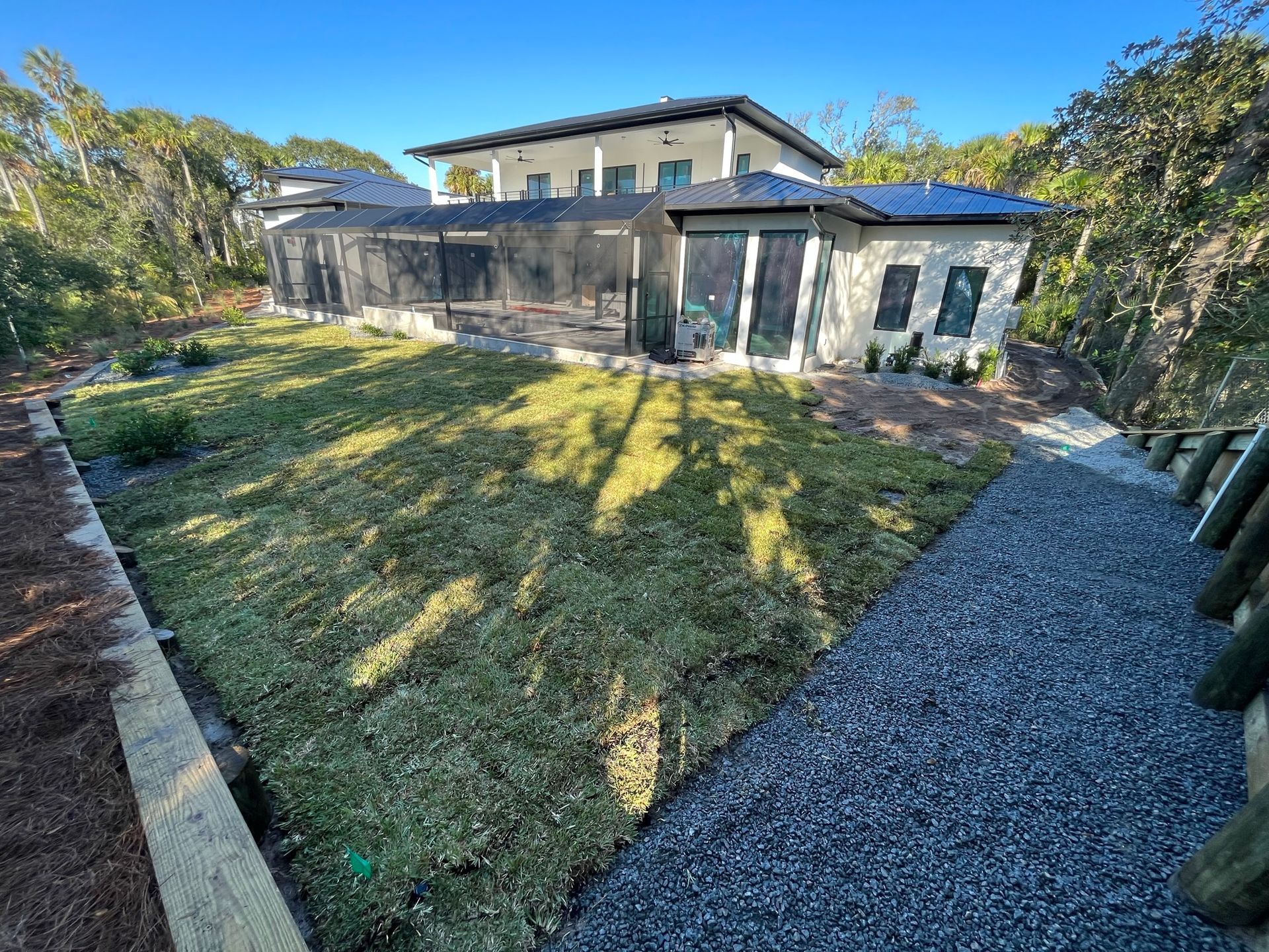 A large house with a large lawn in front of it.