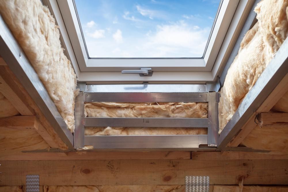 A Skylight Is Being Built Into the Ceiling of A House — Bradley Roofing in Tuncurry, NSW