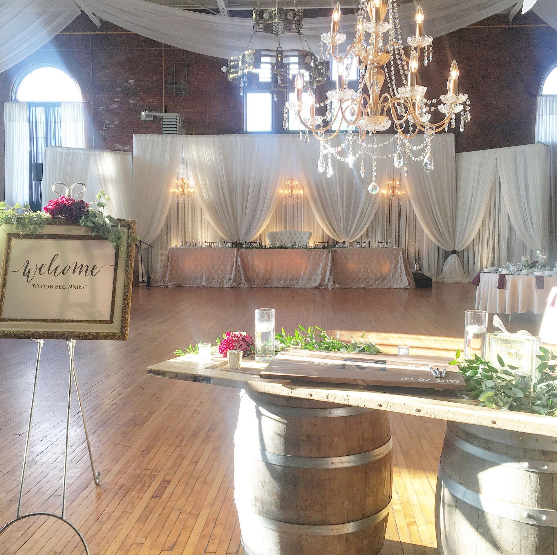 A large room with tables and a sign that says 