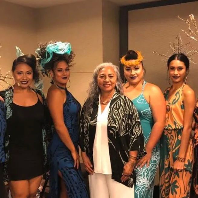 A group of women are posing for a picture together
