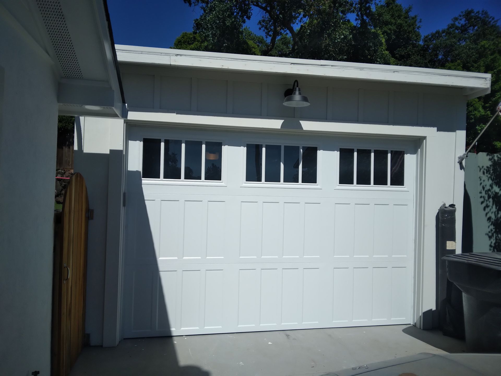 The outside of a white garage door installation in Fairfield, CA by Garage Door Excellence