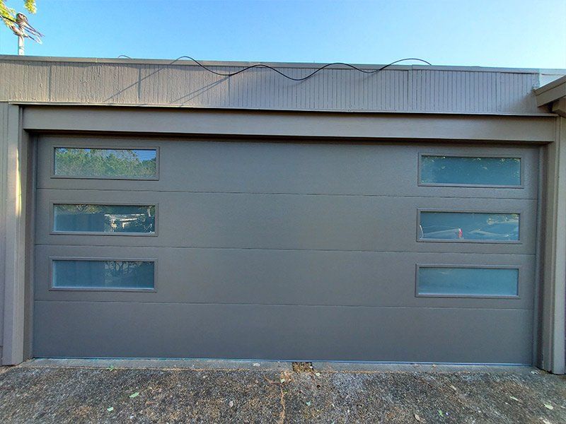 A garage door with a lot of windows on it.