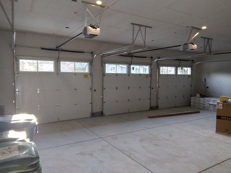 Garage Door Maintenance Service Near You A triple door garage maintenance in the Greater Bay Area provided by Garage Door Excellence