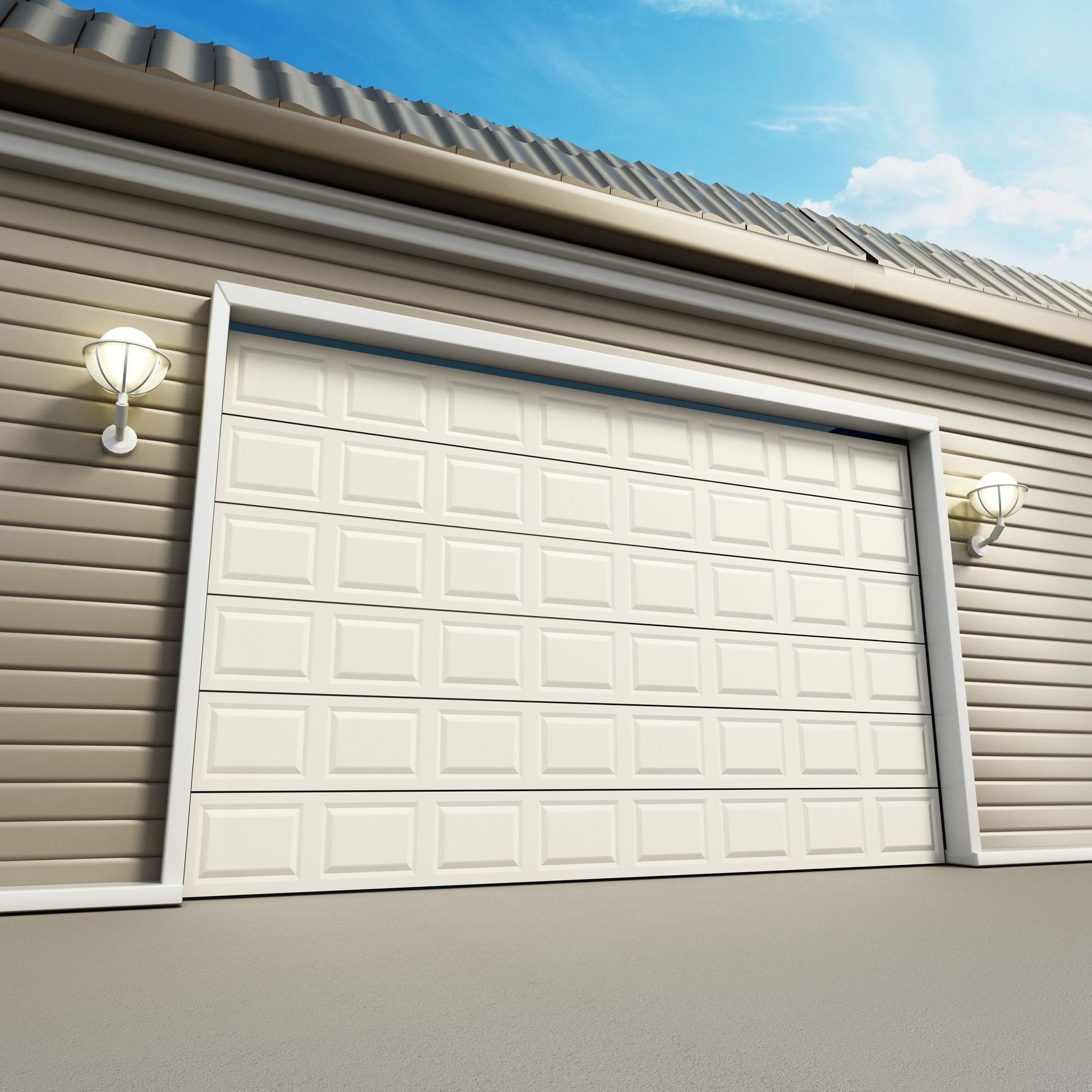 White garage door on a gray-sided house with two wall lanterns and a blue sky above