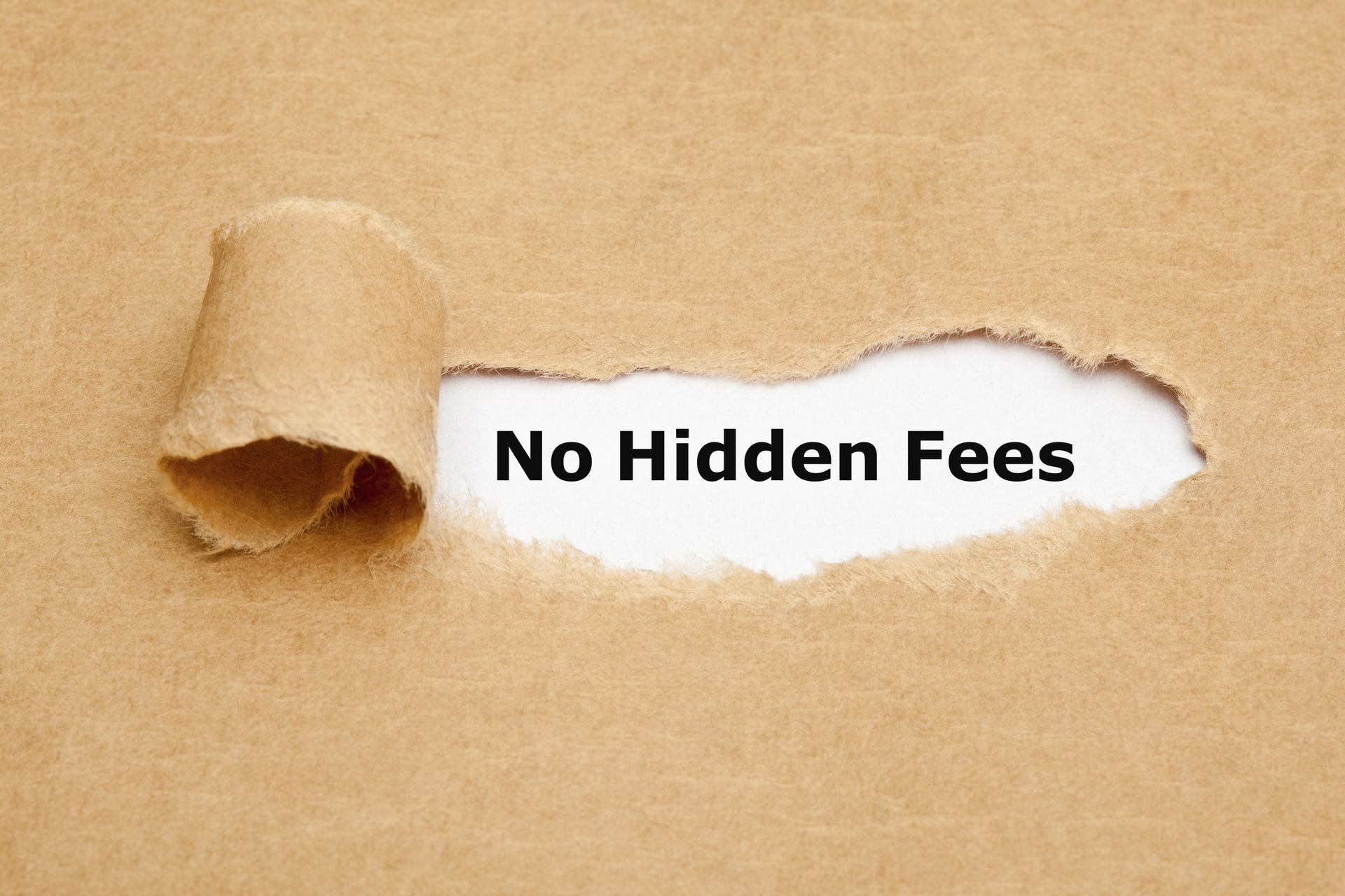 Torn brown paper revealing “No Hidden Fees” in bold black text