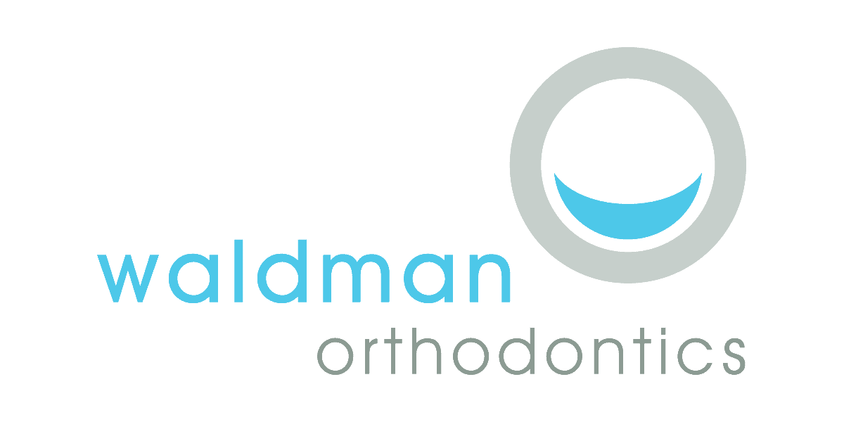 The logo for waldman orthodontics shows a smile in a circle.