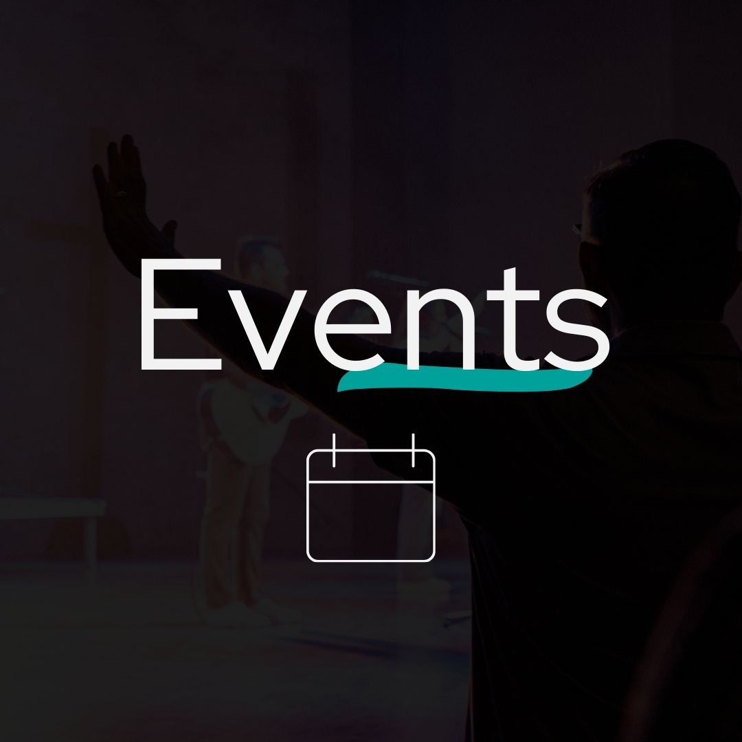 A person is standing in front of a sign that says events.