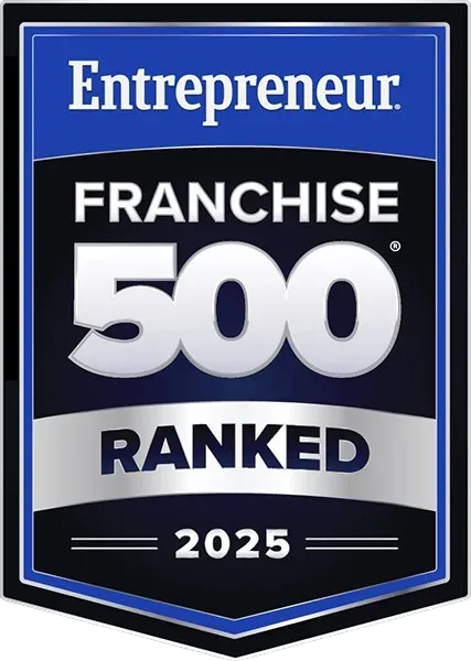 Entrepreneur Franchise 500 award badge in blue, silver, and black; 