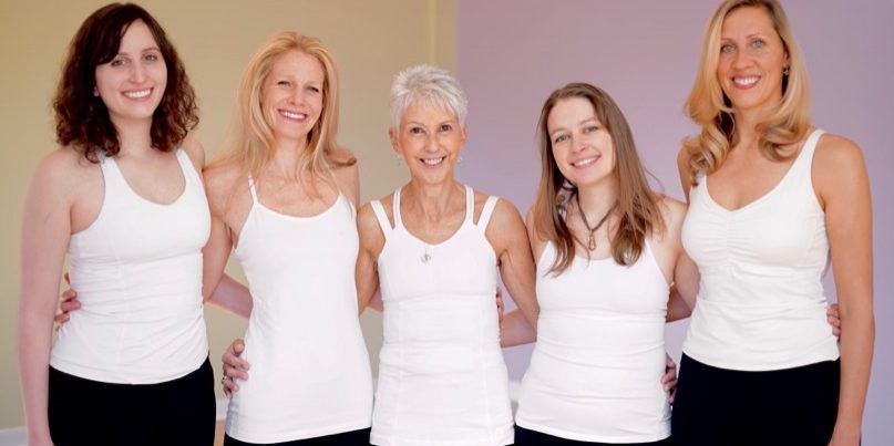 a group of women posing for a photo