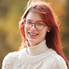 Woman with Red Hair and Glasses – Mary Esther, FL – Primary Eye Care Center Woman with Red Hair and Glasses – Mary Esther, FL – Primary Eye Care Center
