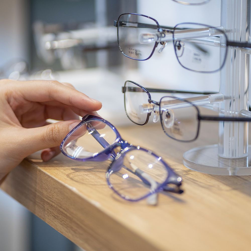 Person Holding a Glasses – Mary Esther, FL – Primary Eye Care Center Person Holding a Glasses – Mary Esther, FL – Primary Eye Care Center