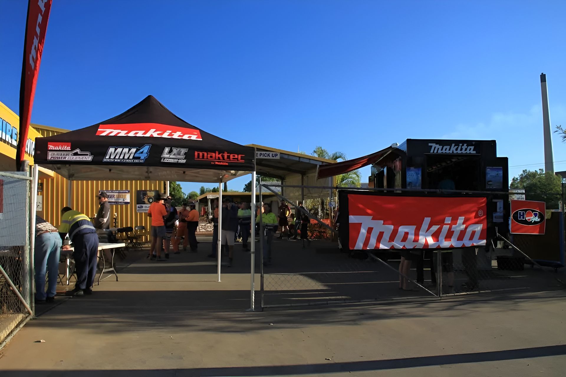 Makita Tools Event. People Near a Tent and Trailer — Mount Isa Hire Service & Sales in Mount Isa City, QLD