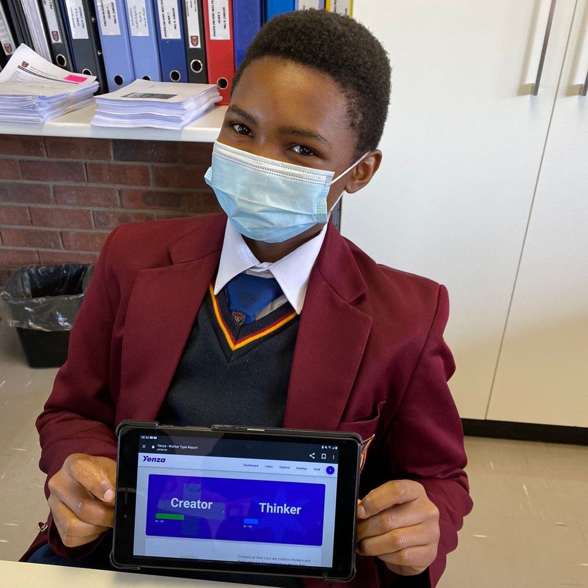 Boy holding an ipad