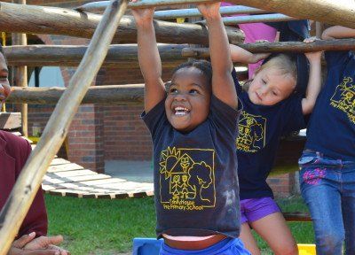 a group of children are playing on a playground