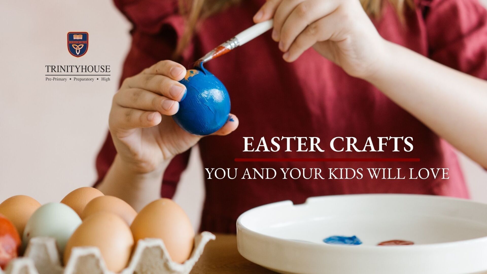 A kid painting an egg