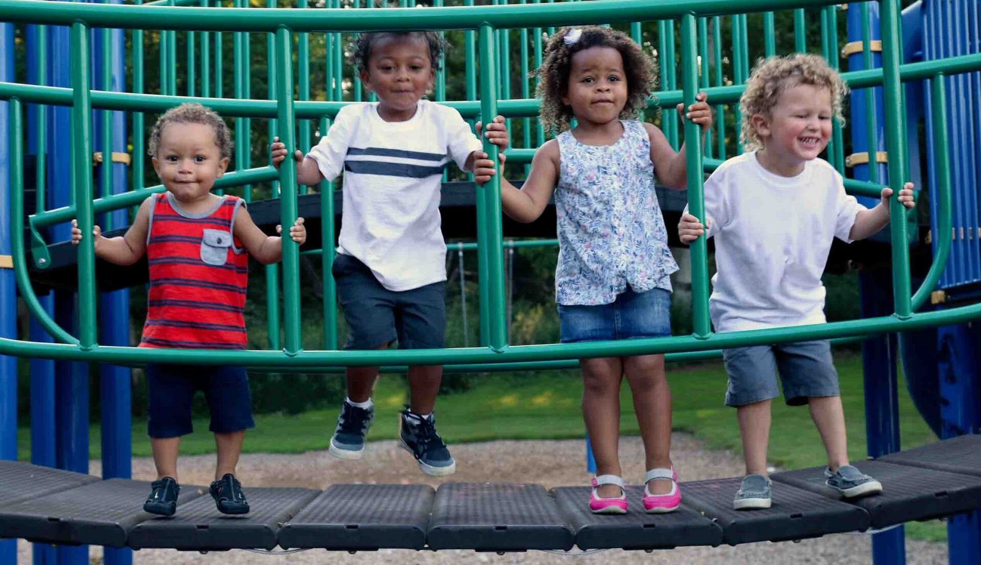 A group of children are playing on a playground.