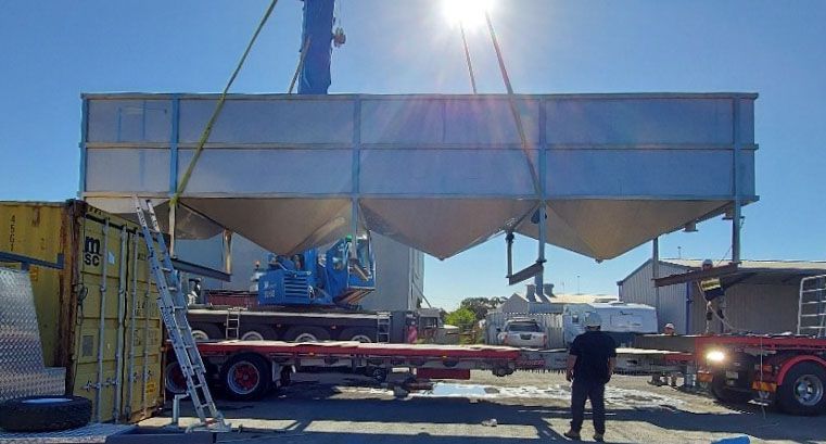 Large water treatment tank on a crane