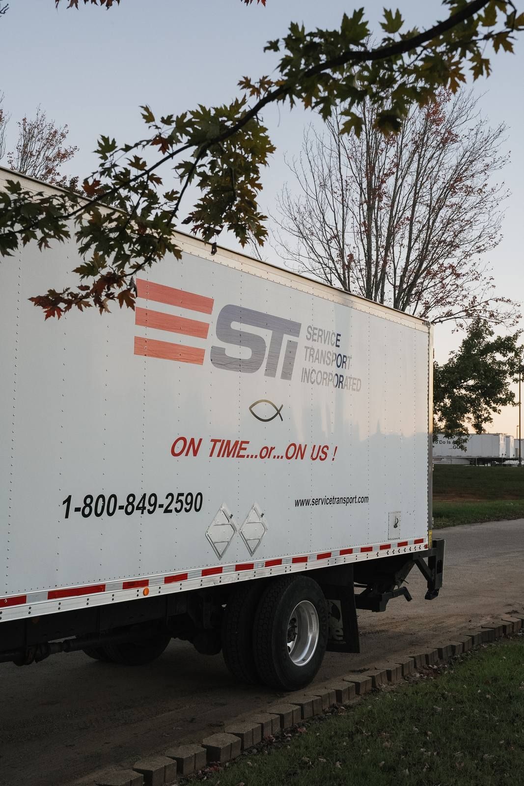 STI box truck with the 1-800 number and On Time… or… On Us! slogan