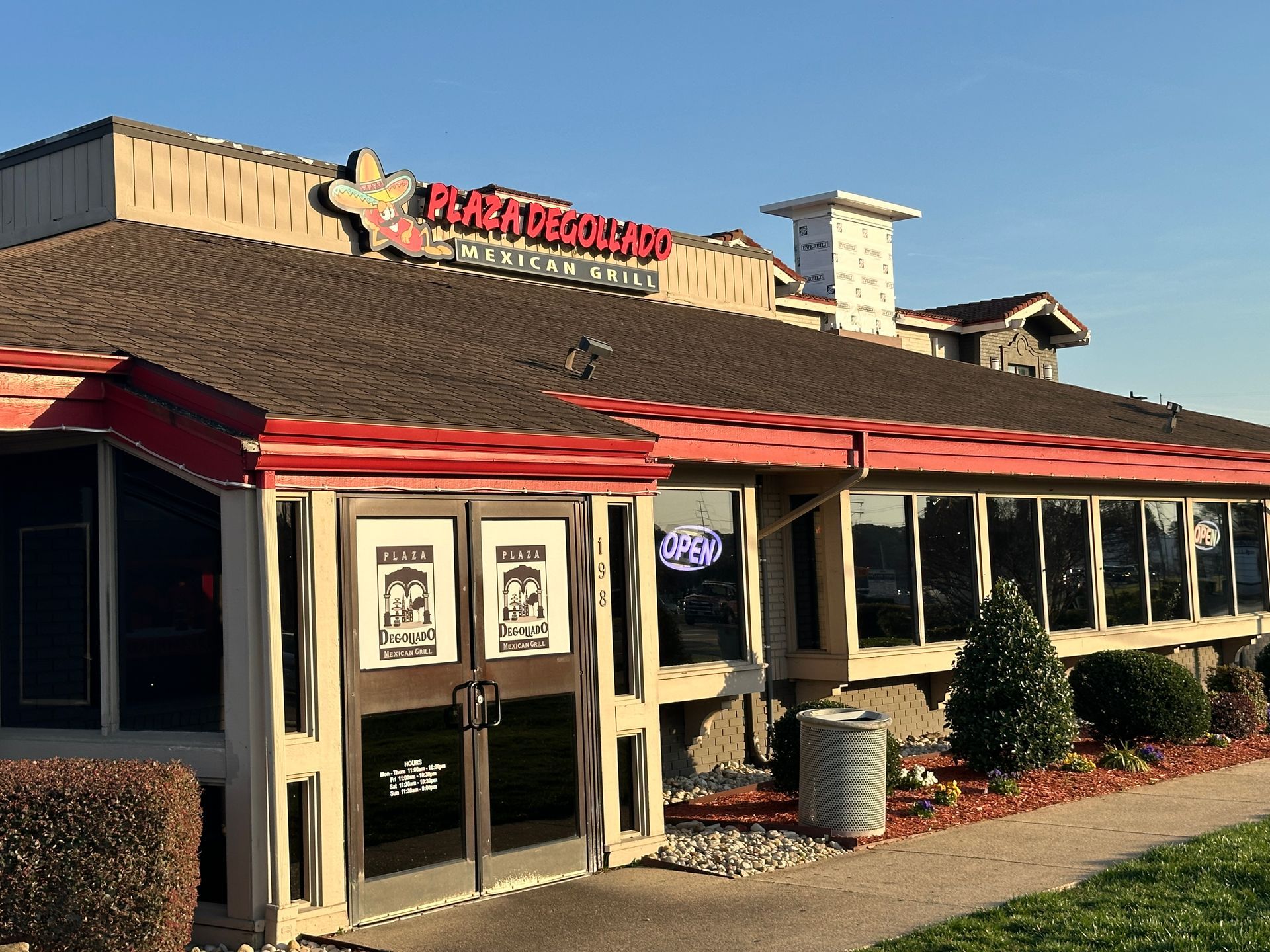 Peach Orchard restaurant exterior with brown roof, red trim, and large windows.