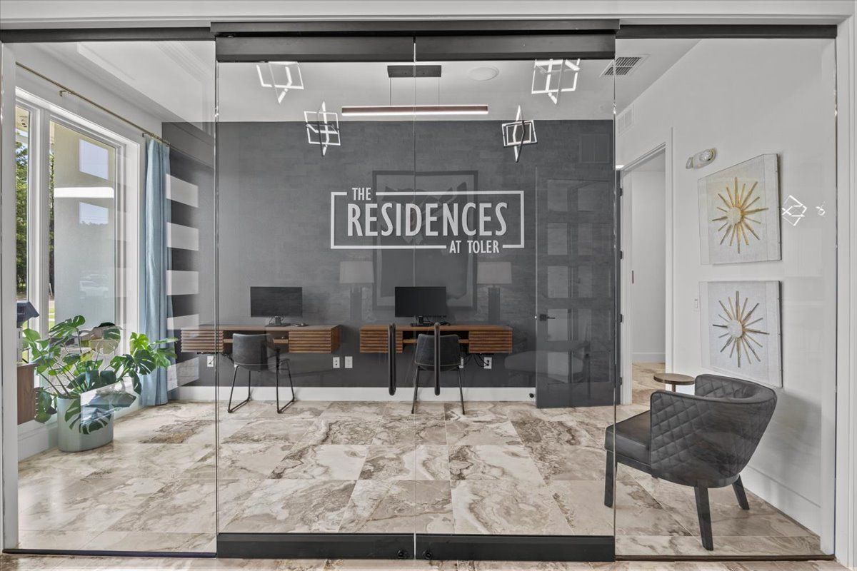 Modern office space with computers, seating, and 