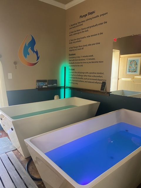 Two plunge tubs with water of different colors inside, in a spa room.